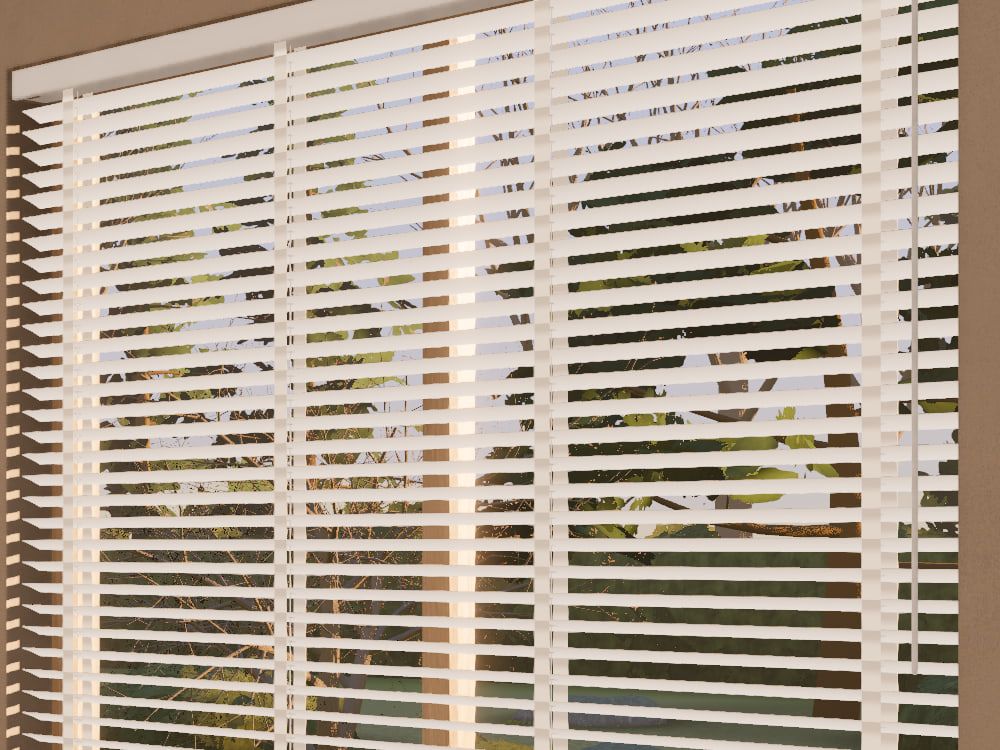 A white wooden Venetian blind close up, its slats tilted, with a sunlit garden showing between them.